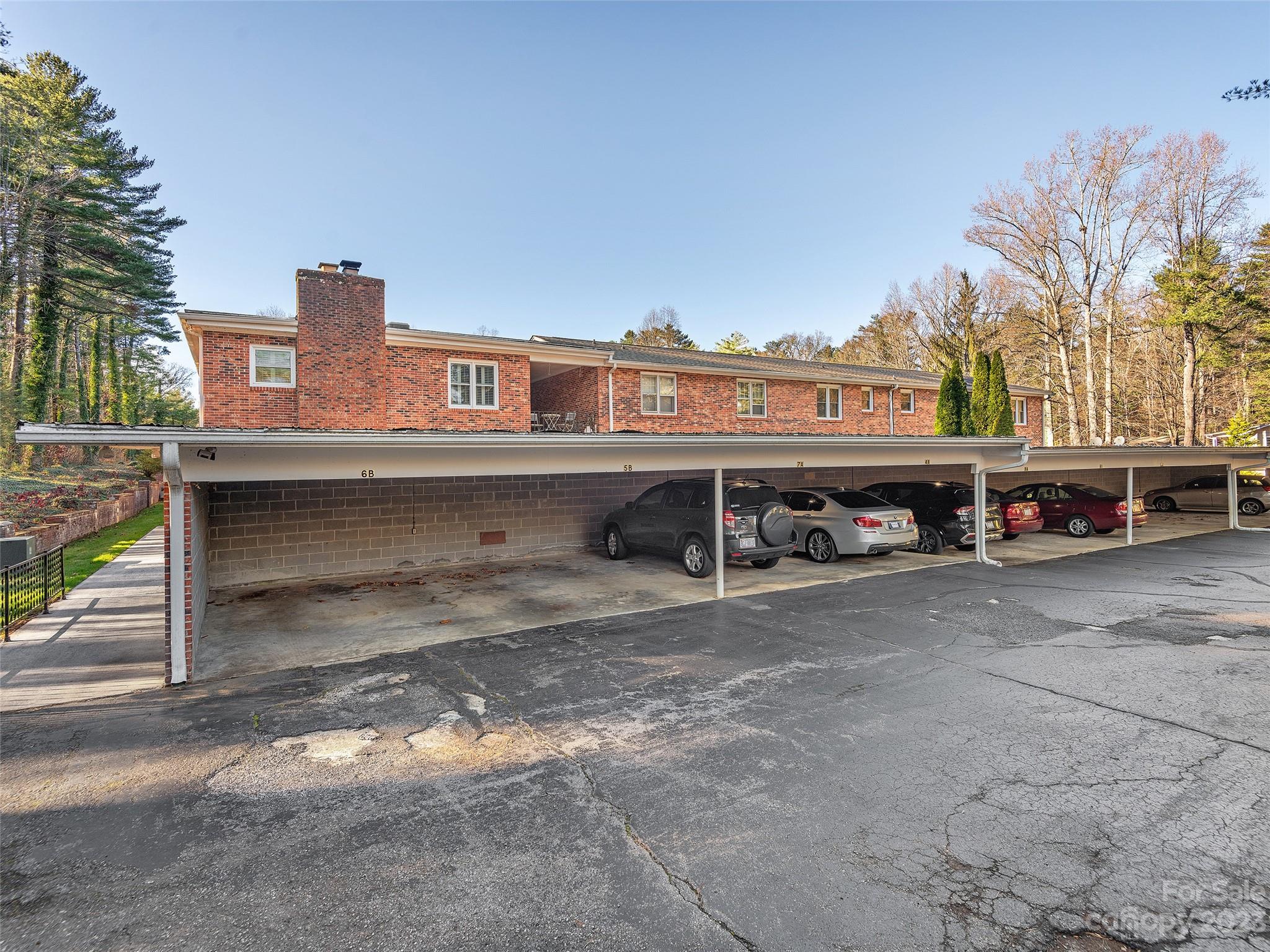 102 Boyd Drive, Unit 5B Flat Rock, NC 28731 - Photo 14 of 16 a view of a street with cars