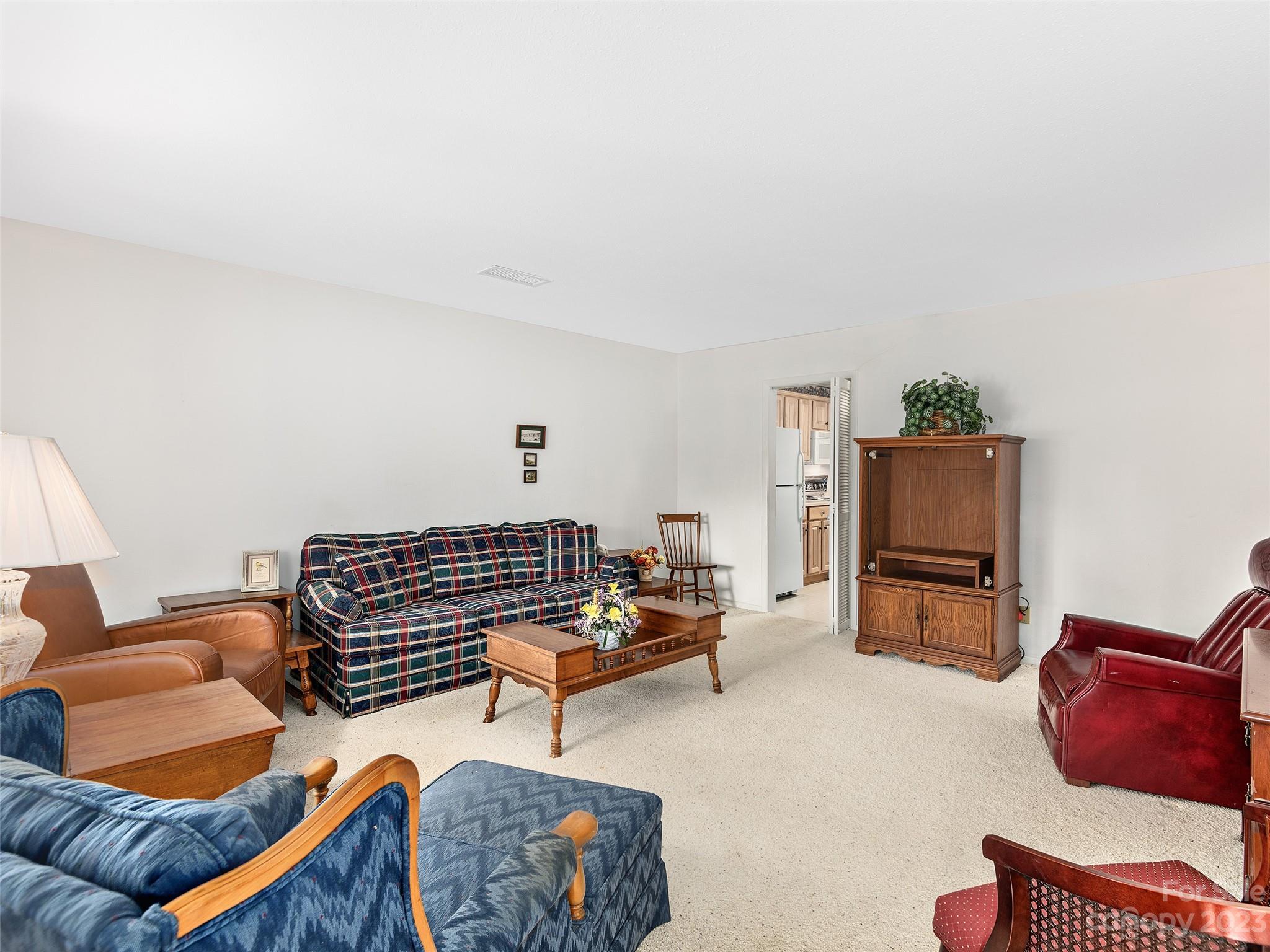 102 Boyd Drive, Unit 5B Flat Rock, NC 28731 - Photo 4 of 16 a living room with furniture and a couch