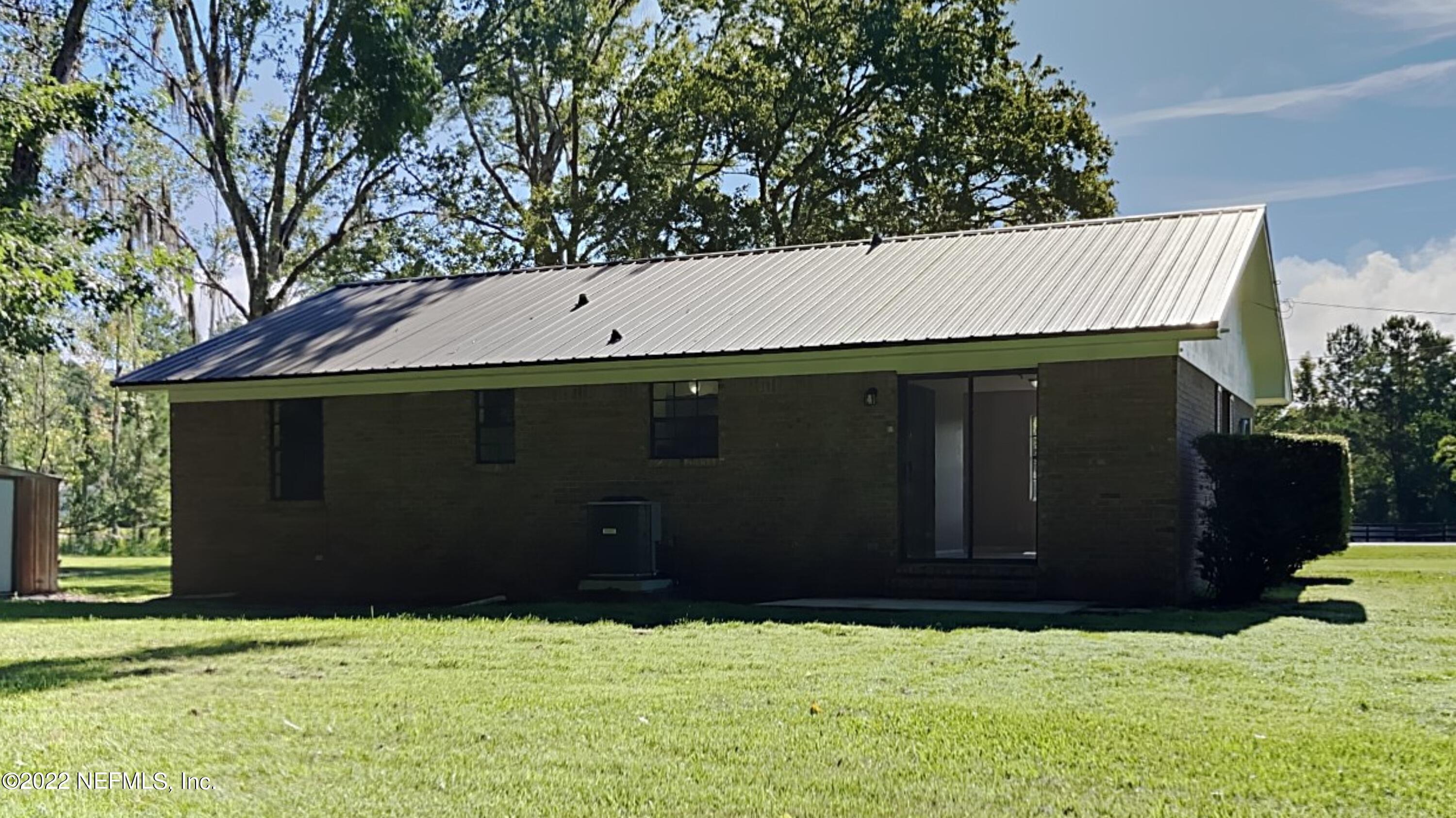 54189 Vikki Road Callahan, FL 32011 - Photo 16 of 18 a view of house with yard and garage