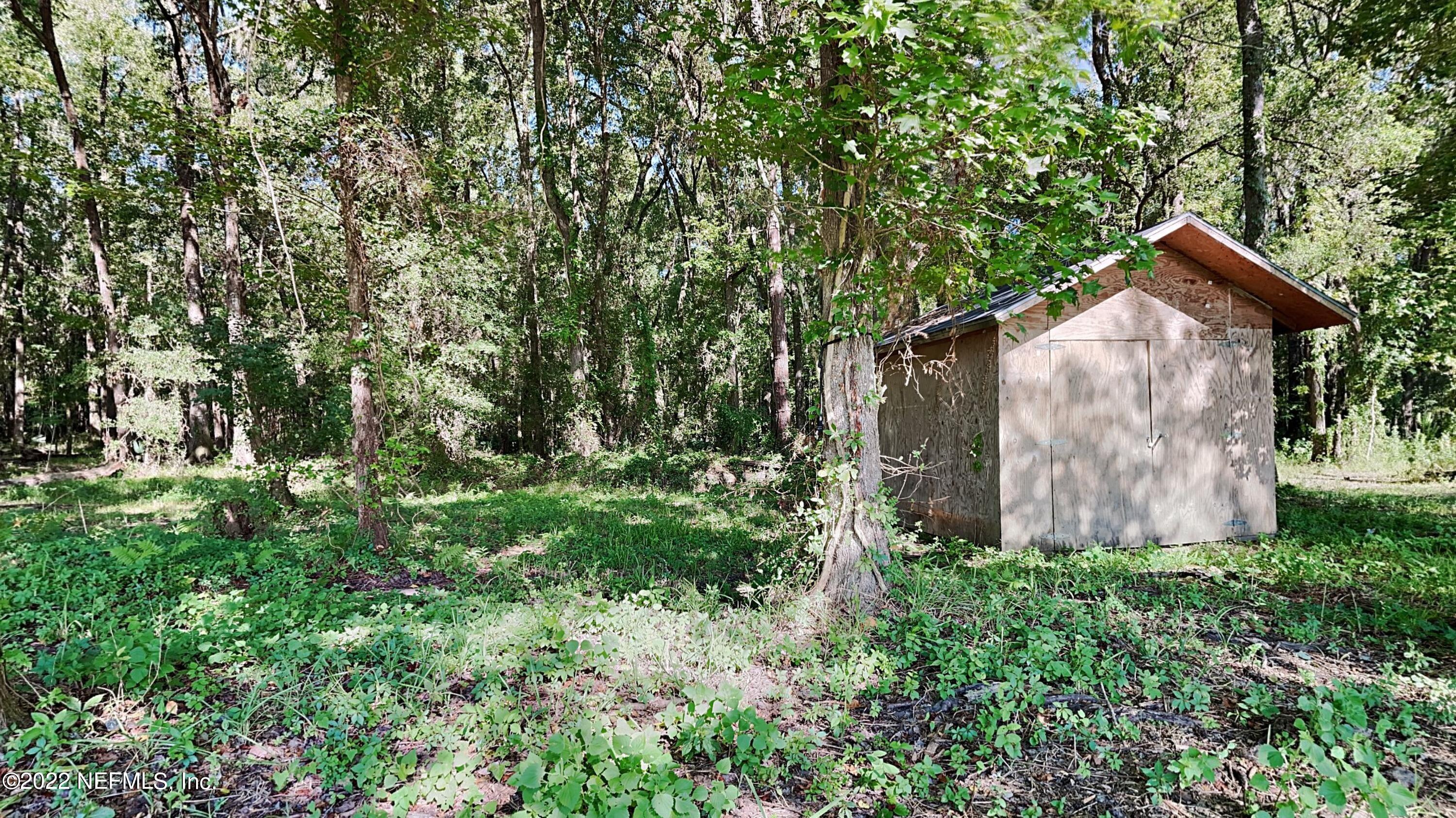 54189 Vikki Road Callahan, FL 32011 - Photo 17 of 18 a view of backyard with green space