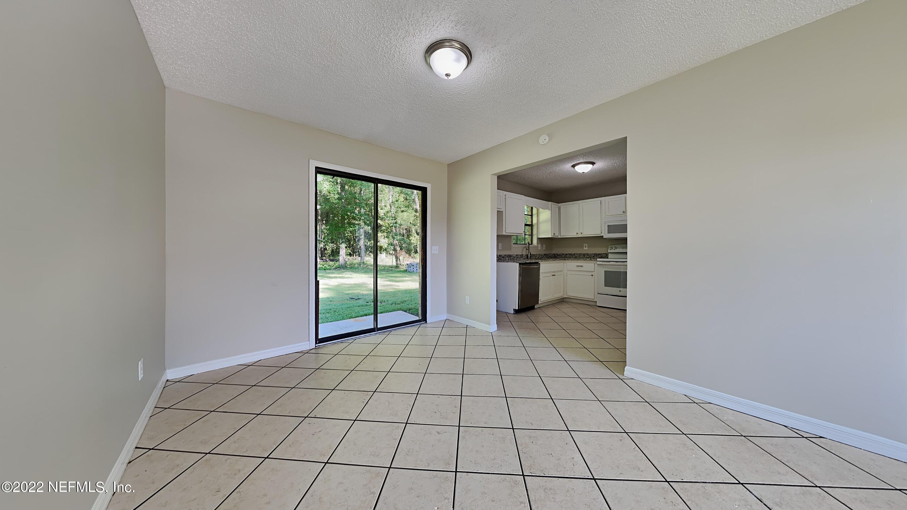 54189 Vikki Road Callahan, FL 32011 - Photo 2 of 18 a view of an empty room with a window