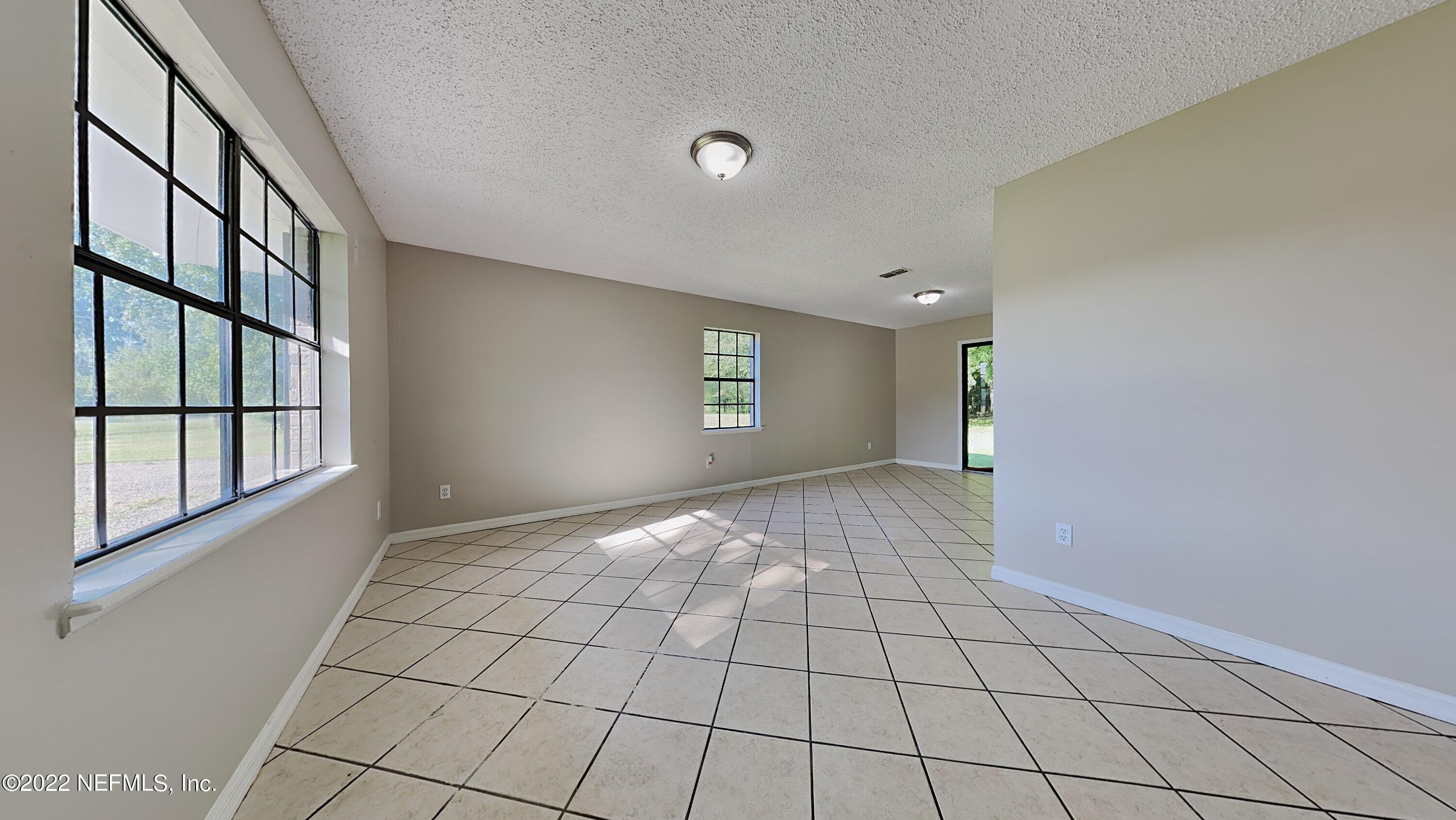 54189 Vikki Road Callahan, FL 32011 - Photo 3 of 18 a view of an empty room and window