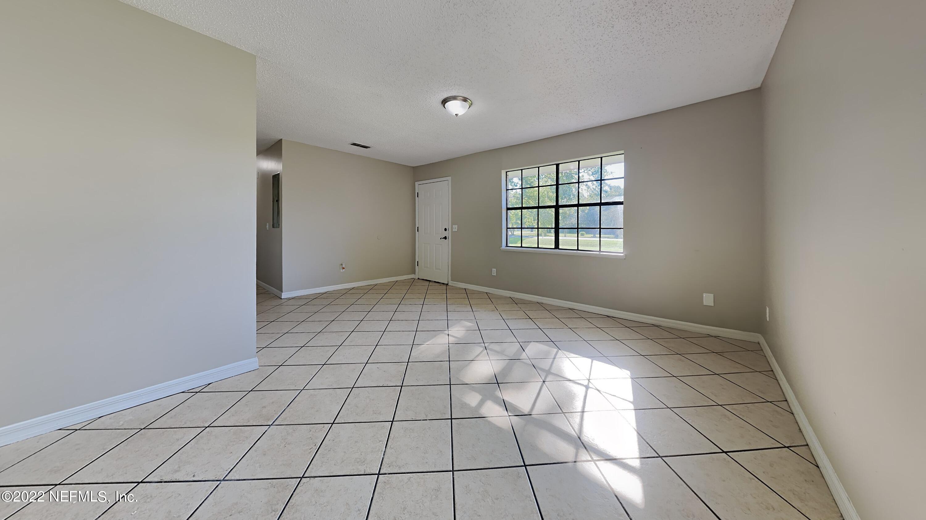 54189 Vikki Road Callahan, FL 32011 - Photo 4 of 18 a view of an empty room and window