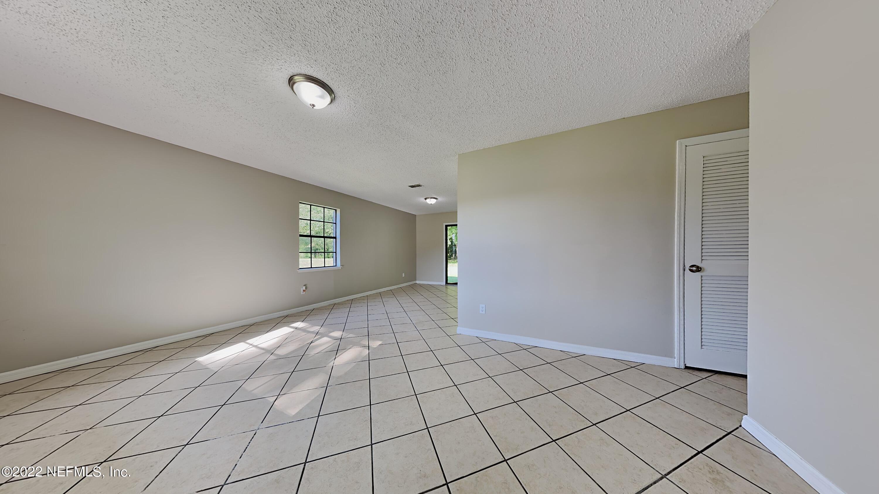 54189 Vikki Road Callahan, FL 32011 - Photo 5 of 18 a view of an empty room and window