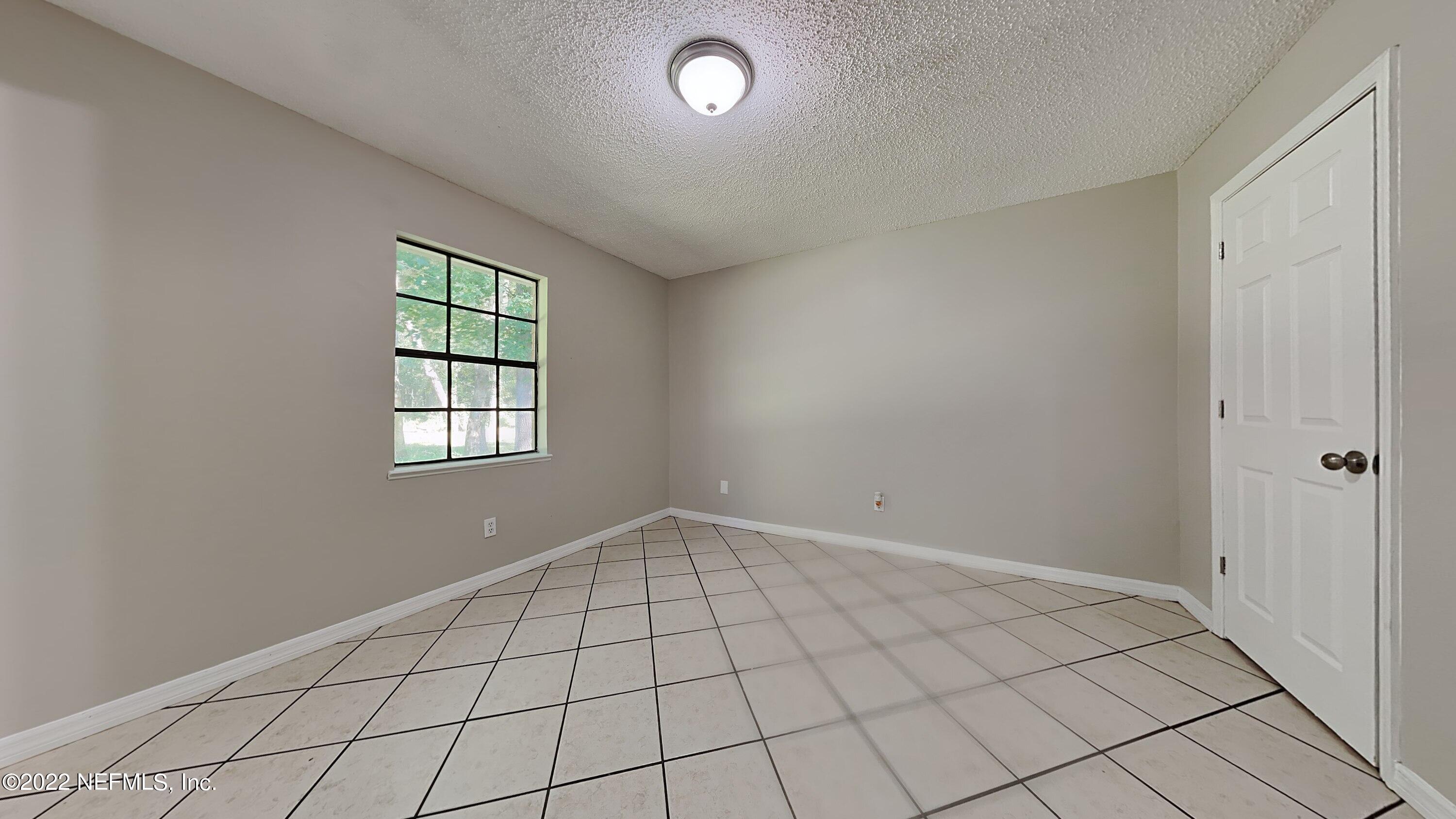 54189 Vikki Road Callahan, FL 32011 - Photo 7 of 18 a view of an empty room and window