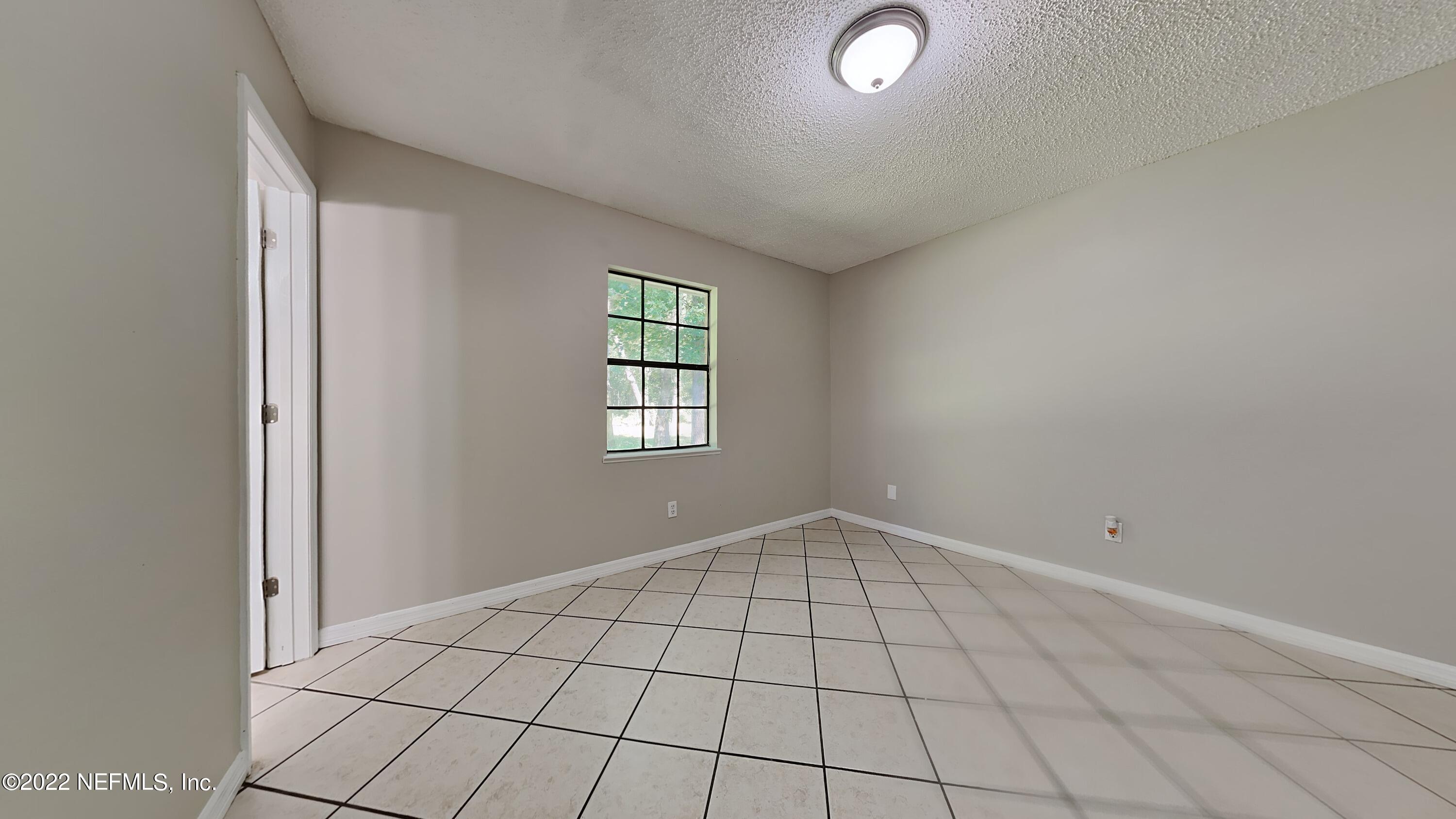 54189 Vikki Road Callahan, FL 32011 - Photo 8 of 18 a view of an empty room and window