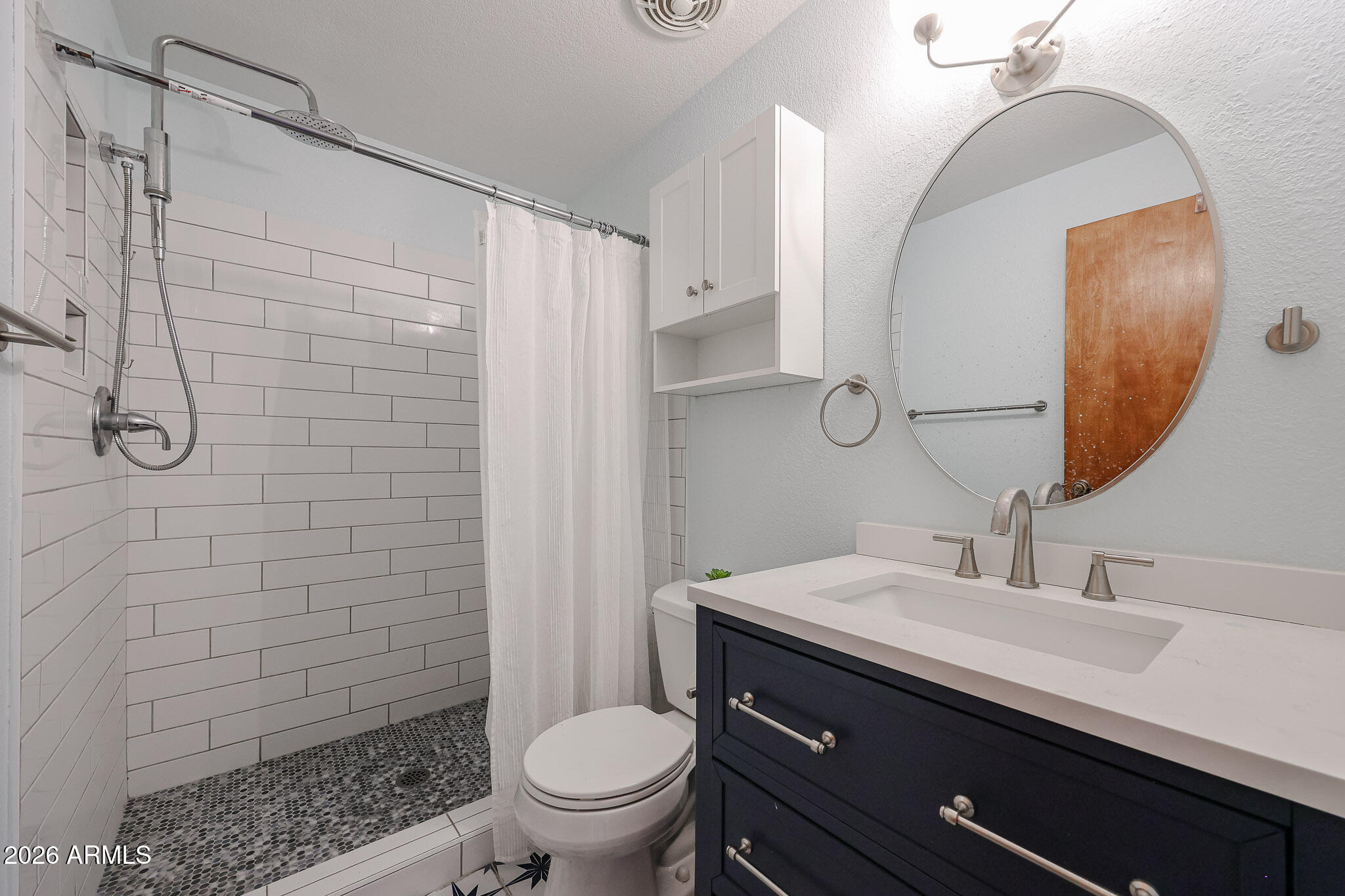 5114 East Monte Vista Road Phoenix, AZ 85008 - Photo 14 of 45 a bathroom with a sink a toilet and shower