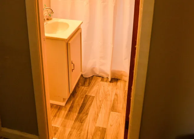 a bathroom with a toilet and a sink