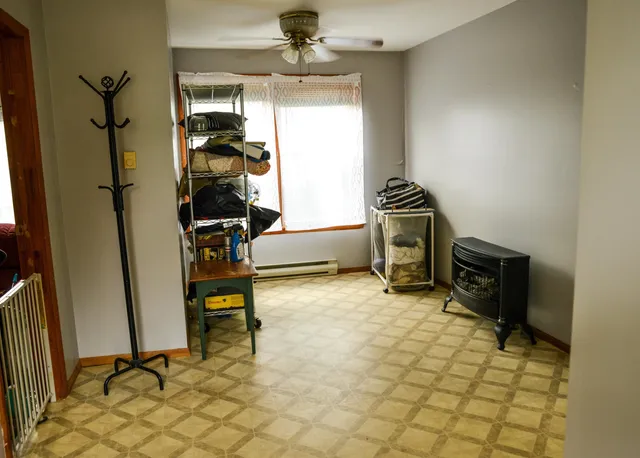 a bedroom with a bed and a dresser