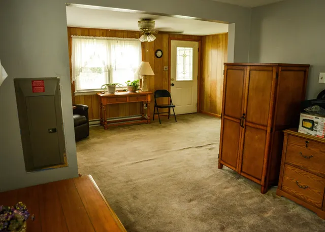 a living room with furniture and a window