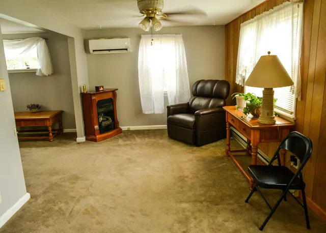 a bathroom with a granite countertop shower and a sink