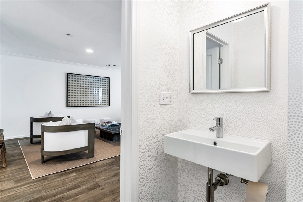 6 Summer Street, Unit D Manchester, MA 01944 - Photo 11 of 31 a bathroom with a sink and a mirror