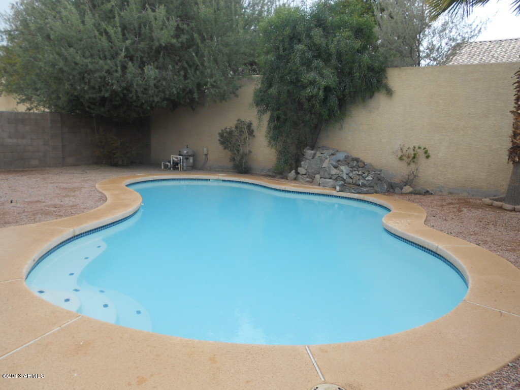 3918 East Agave Road Phoenix, AZ 85044 - Photo 13 of 14 a view of a swimming pool with an outdoor space