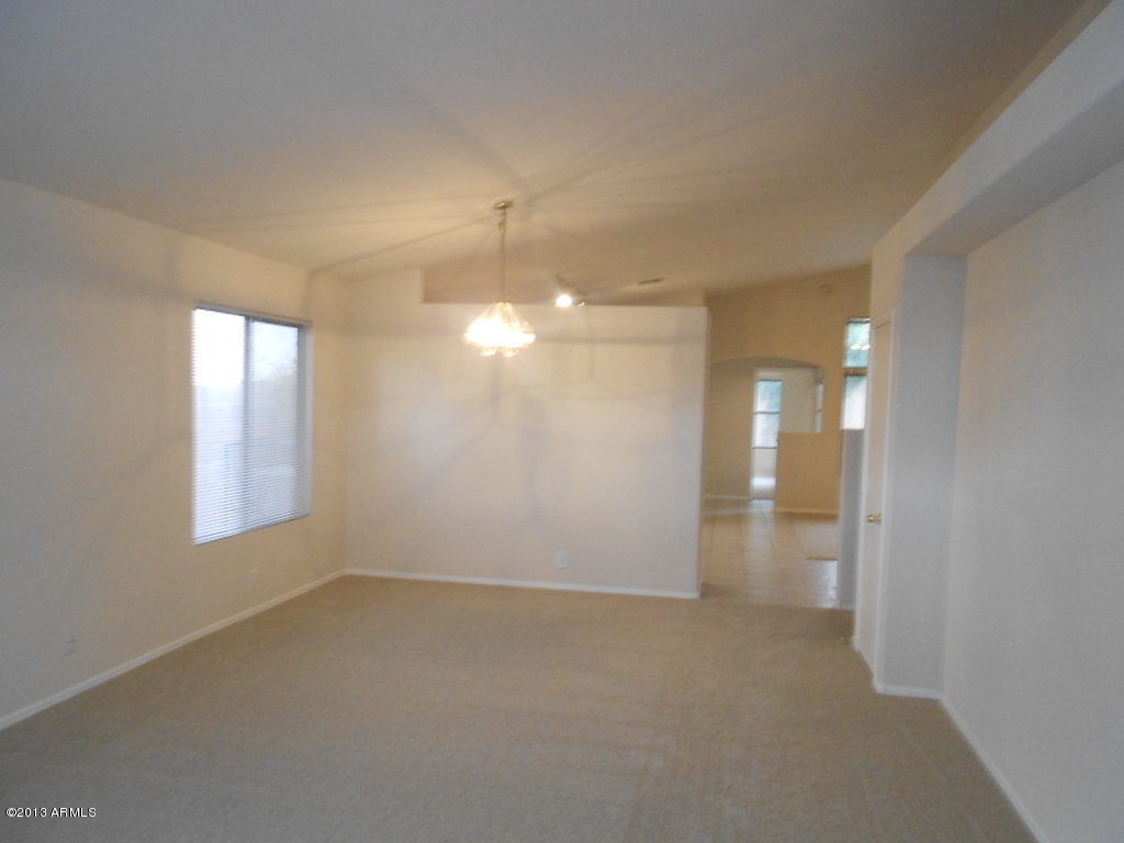 3918 East Agave Road Phoenix, AZ 85044 - Photo 3 of 14 wooden floor in an empty room