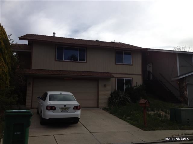 1045 Braddock Court Reno, NV 89503 - Photo 1 of 1 a car parked in front of a house