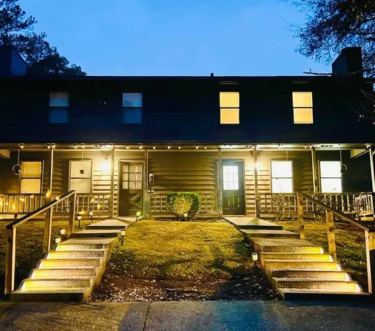 a view of a balcony with two chairs