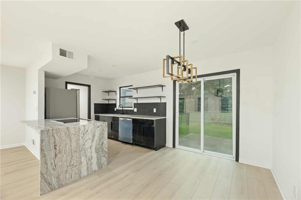 1487 Springwood Drive Southeast, Unit A Smyrna, GA 30080 - Photo 19 of 19 a kitchen with stainless steel appliances granite countertop a refrigerator and a sink
