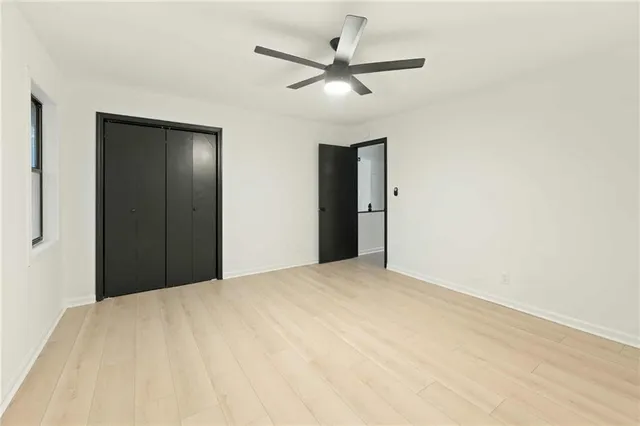 a view of a room with a ceiling fan
