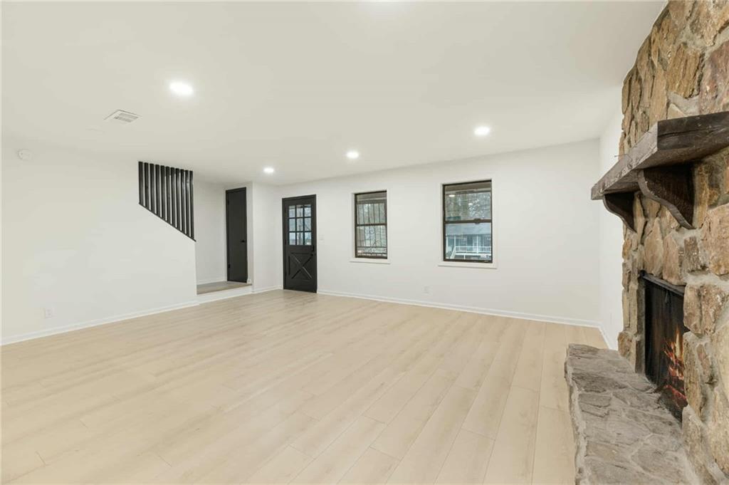 1487 Springwood Drive Southeast, Unit A Smyrna, GA 30080 - Photo 6 of 19 a view of empty room with fireplace and fan