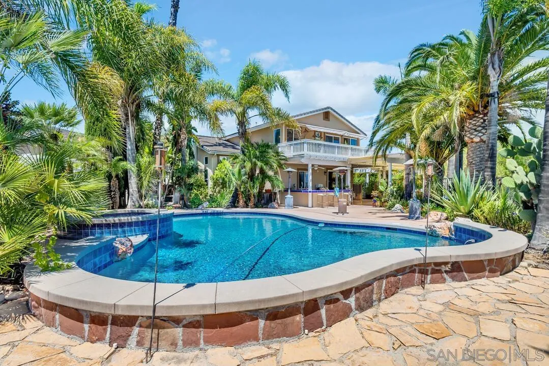 10496 Chaparral Drive Santee, CA 92071 - Photo 63 of 73 a view of a swimming pool with a patio