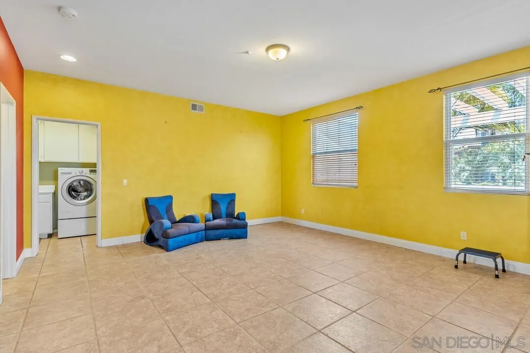 10496 Chaparral Drive Santee, CA 92071 - Photo 7 of 73 a bedroom with a bed and wooden floor