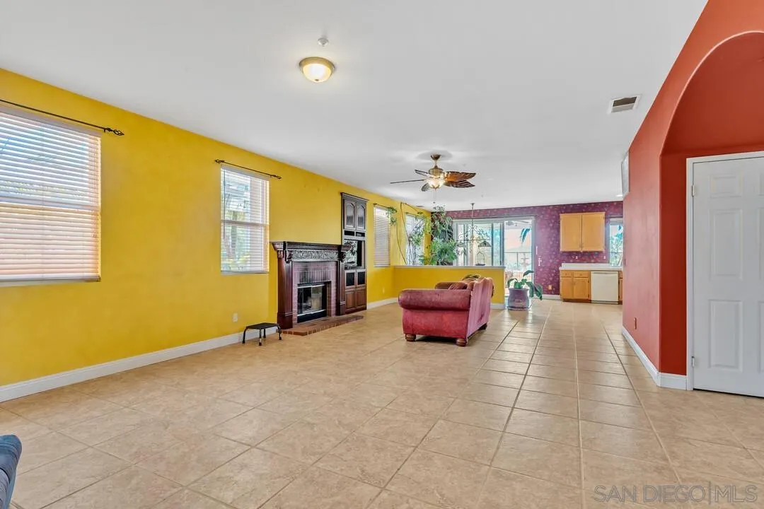 10496 Chaparral Drive Santee, CA 92071 - Photo 8 of 73 a spacious bedroom with furniture and a fireplace