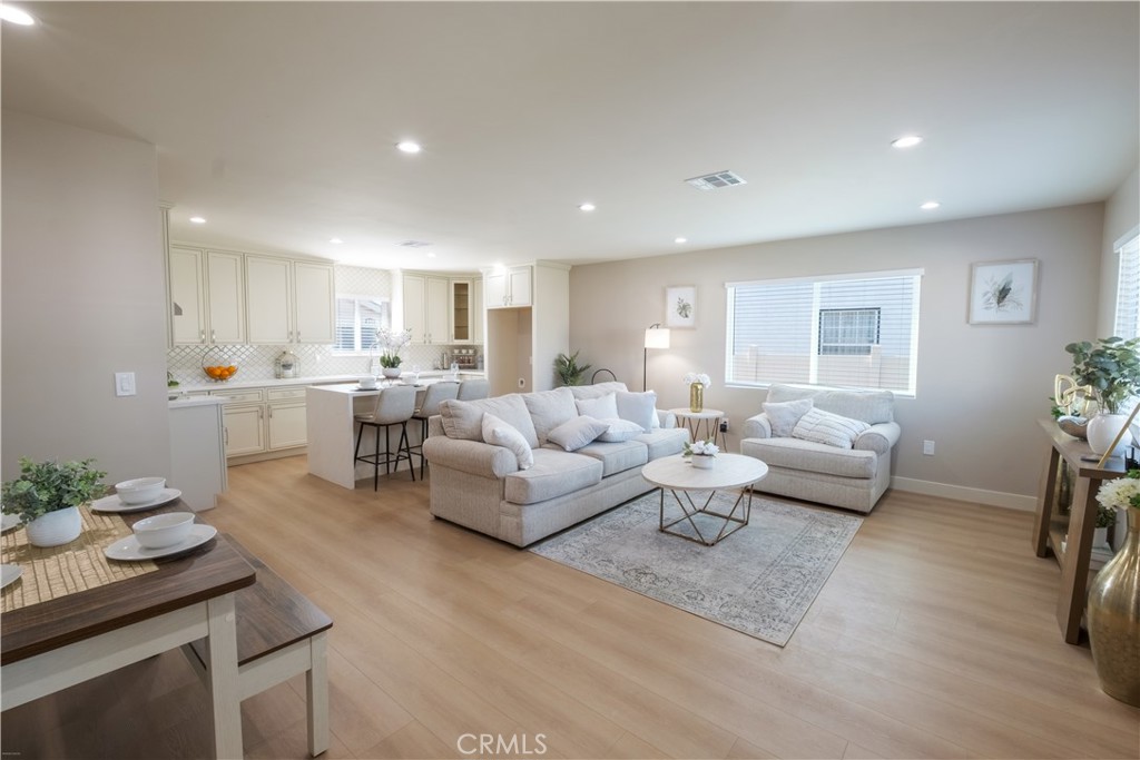 223 South Aprilia Avenue Compton, CA 90220 - Photo 2 of 46 a living room with furniture and a table
