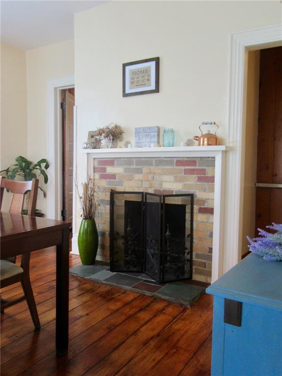 3995 Tuscarawas Road Beaver, PA 15009 - Photo 7 of 25 Wood burning Fireplace with tile hearth graces your dining atmosphere!
