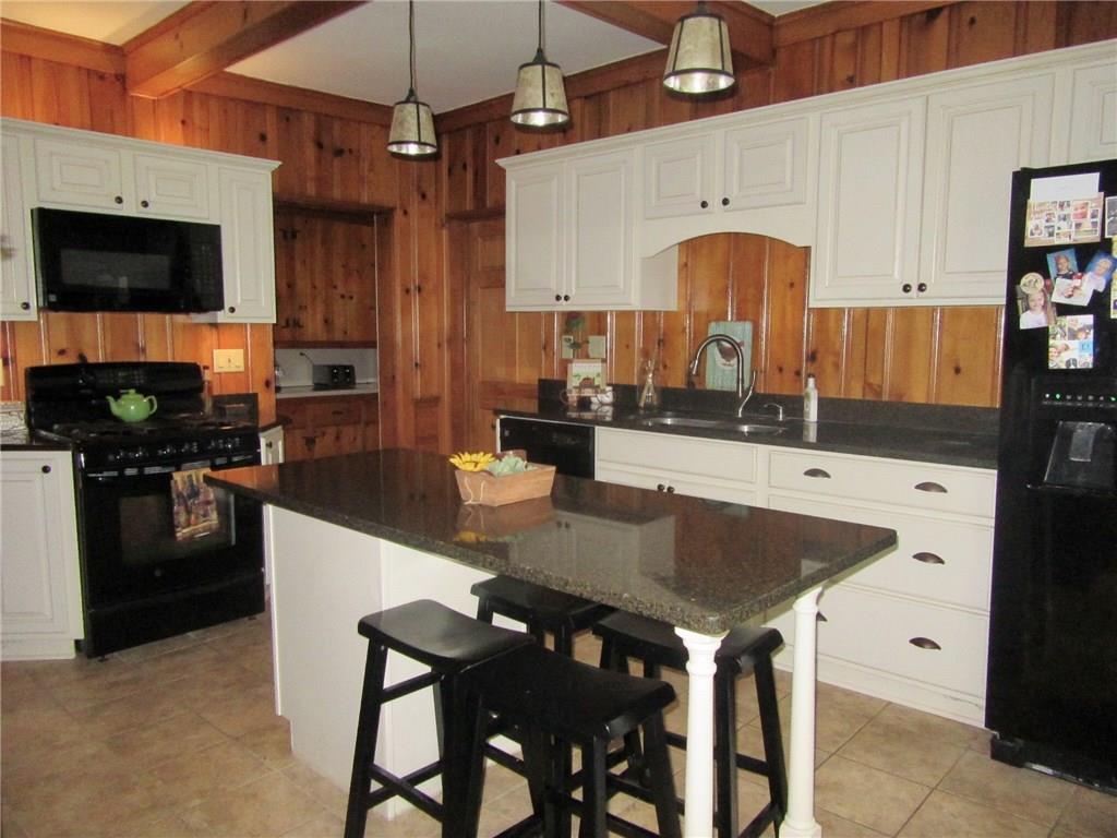 3995 Tuscarawas Road Beaver, PA 15009 - Photo 10 of 25 Elegant quartz counters and exposed ceiling beams beautify this oversized kitchen!