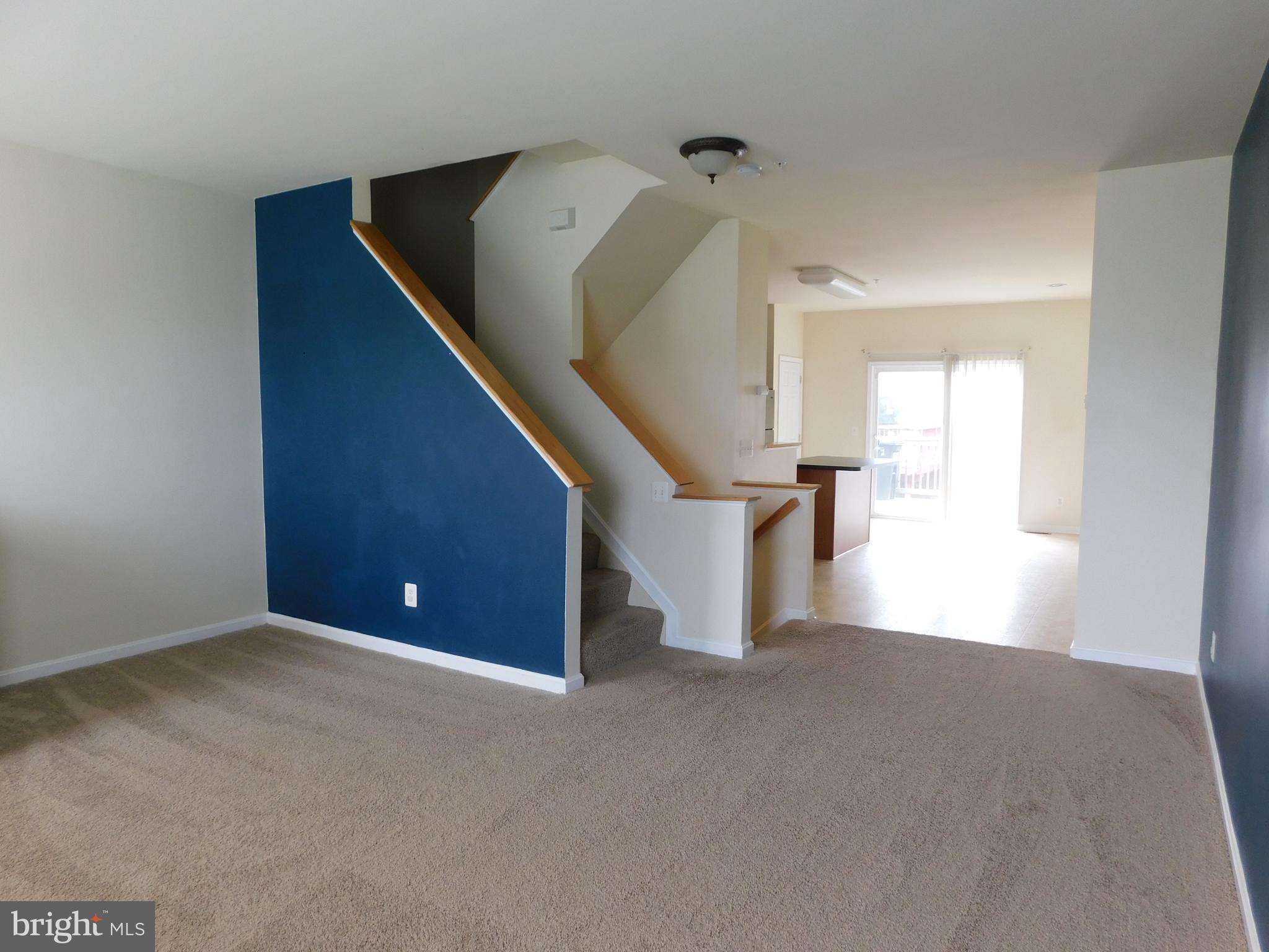 4036 Cutty Sark Road Baltimore, MD 21220 - Photo 11 of 25 a view of an empty room with stairs