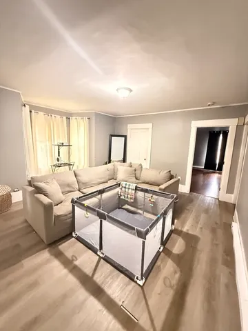 a kitchen with granite countertop a stove a sink and a refrigerator