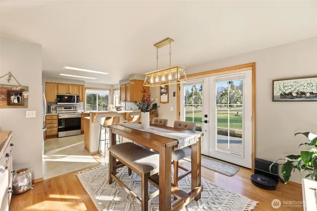 a view of a dining room with furniture window and wooden floor