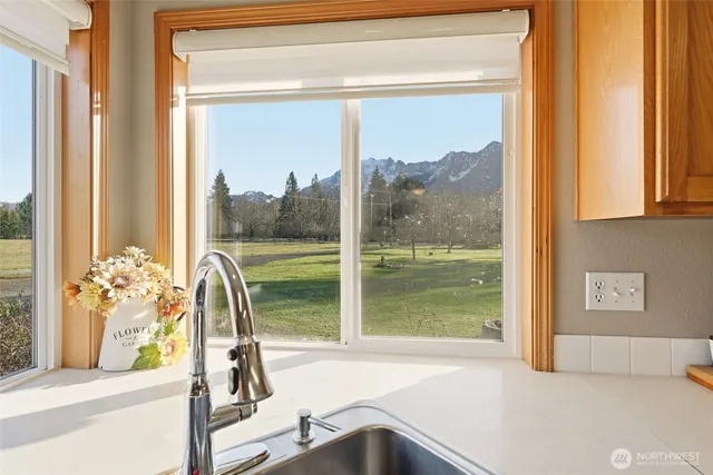 a view of a living room and floor to ceiling window