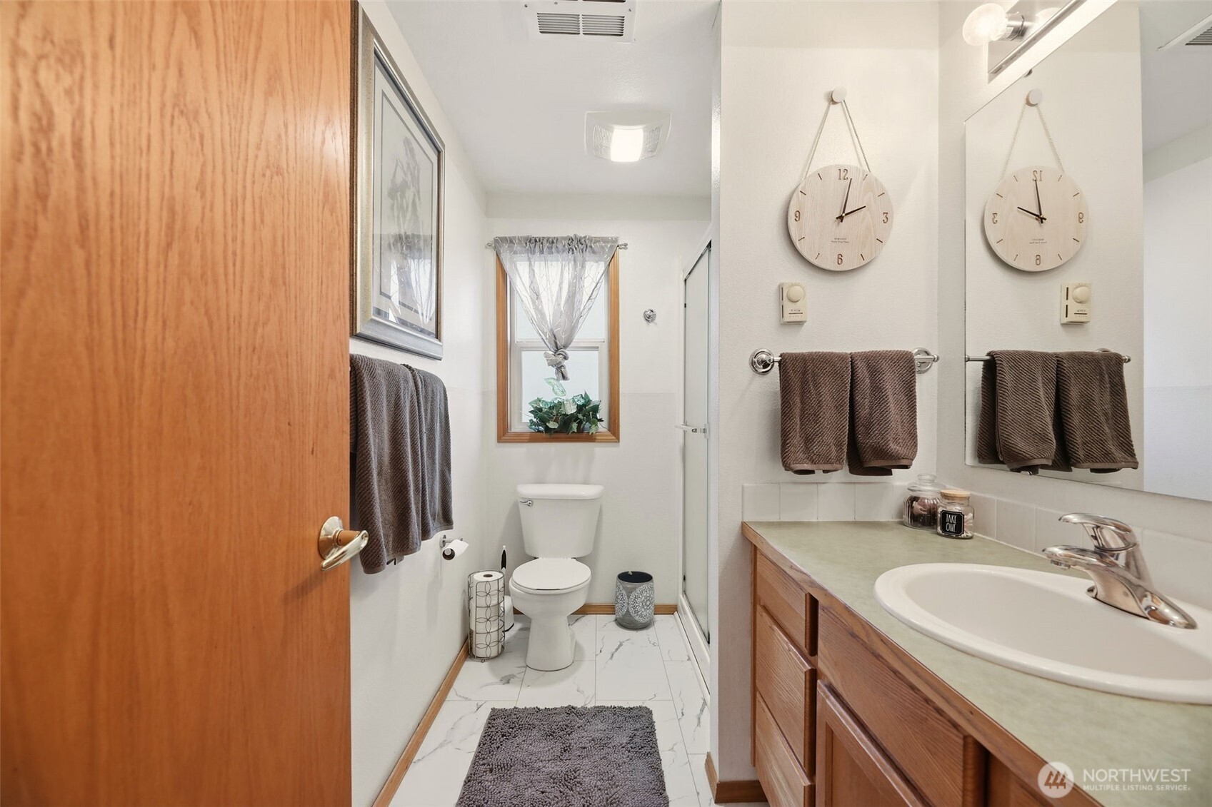 36721 Swede Heaven Road Arlington, WA 98223 - Photo 21 of 40 a bathroom with a double vanity sink and mirror