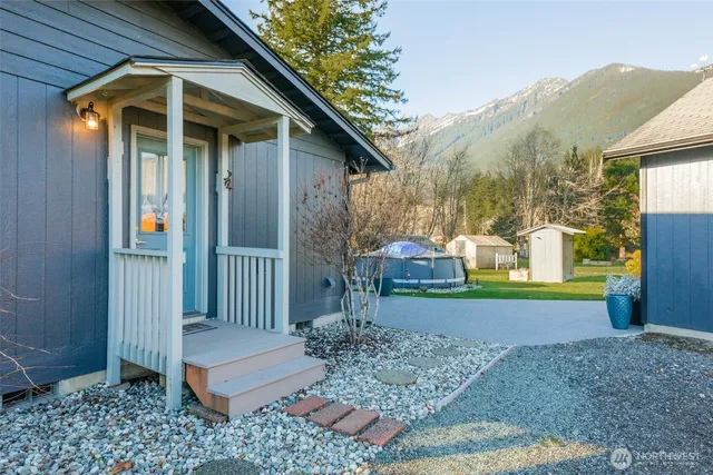 a view of a wooden house with a yard