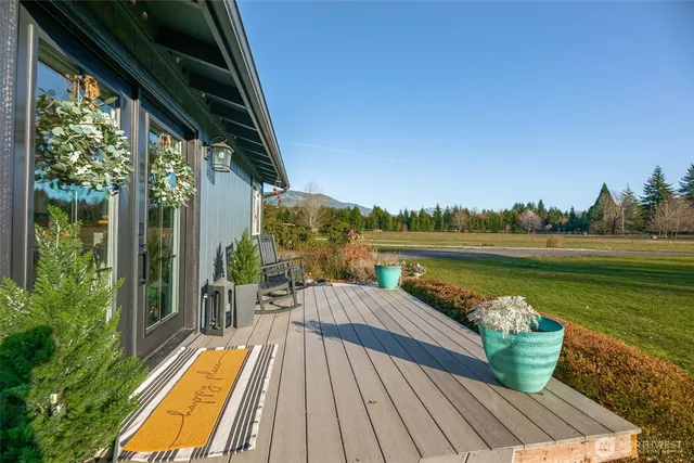 a view of a balcony with lake view and a potted plant