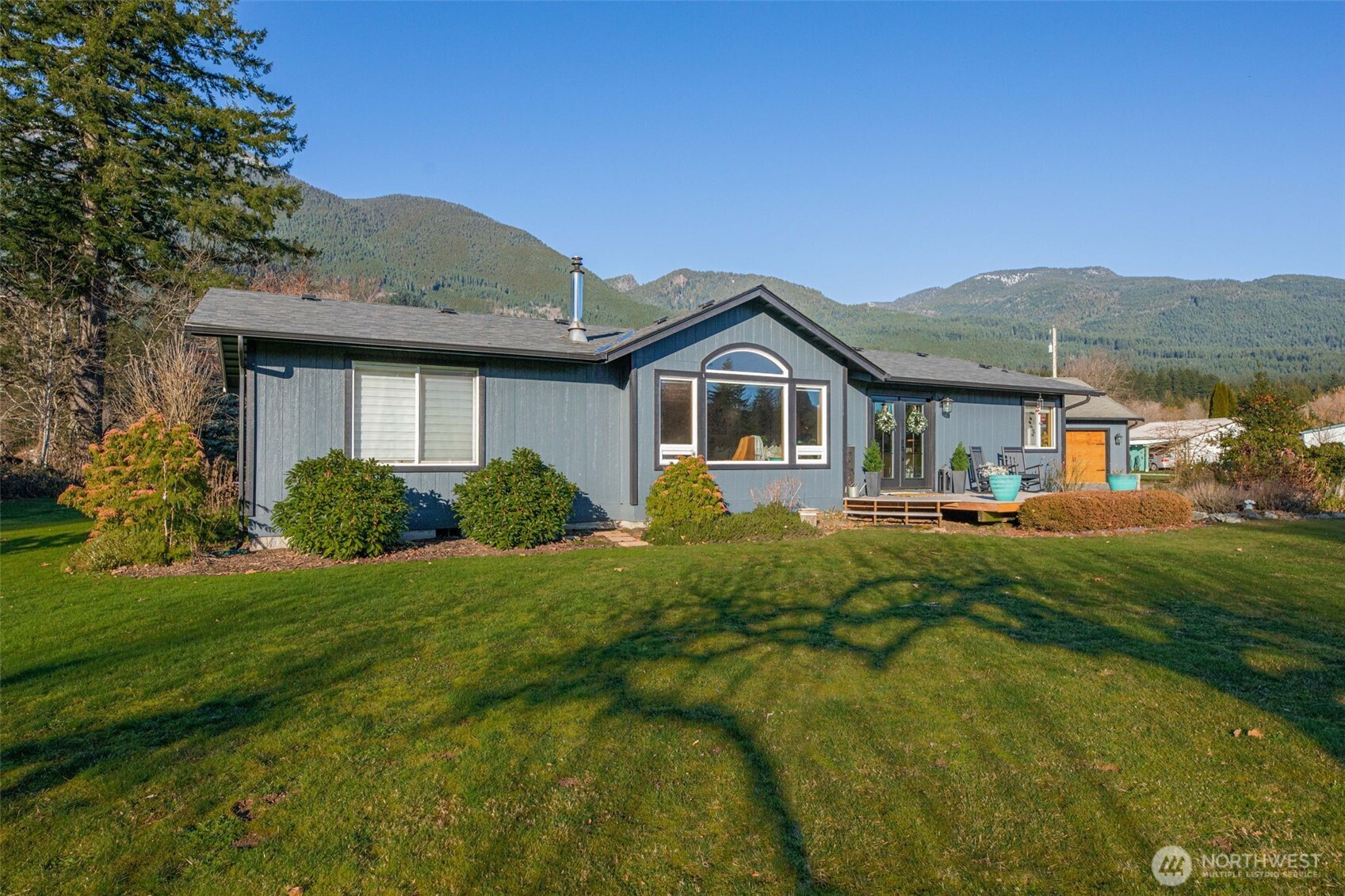 36721 Swede Heaven Road Arlington, WA 98223 - Photo 30 of 40 a front view of a house with a yard