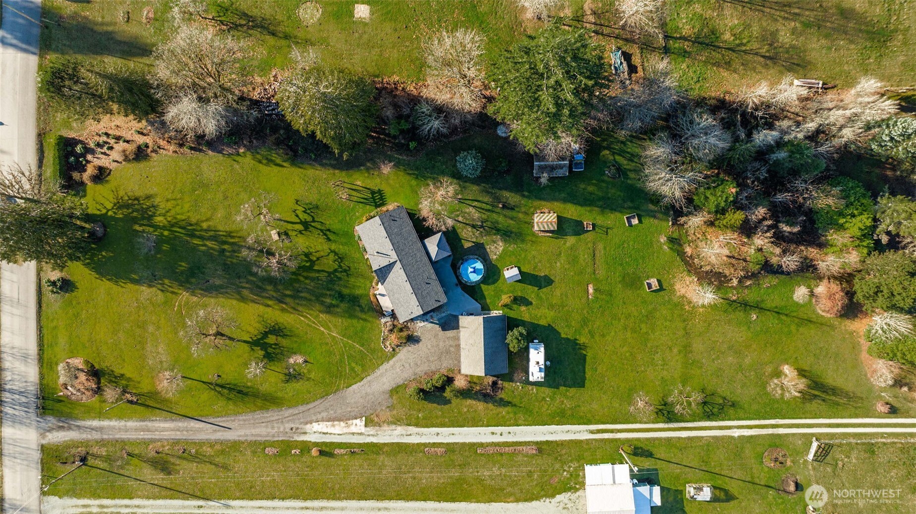 36721 Swede Heaven Road Arlington, WA 98223 - Photo 39 of 40 an aerial view of a house with a yard basket ball court and outdoor seating