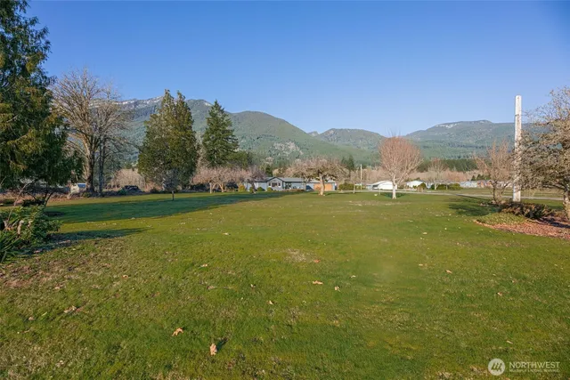 a view of a town with mountains in the background