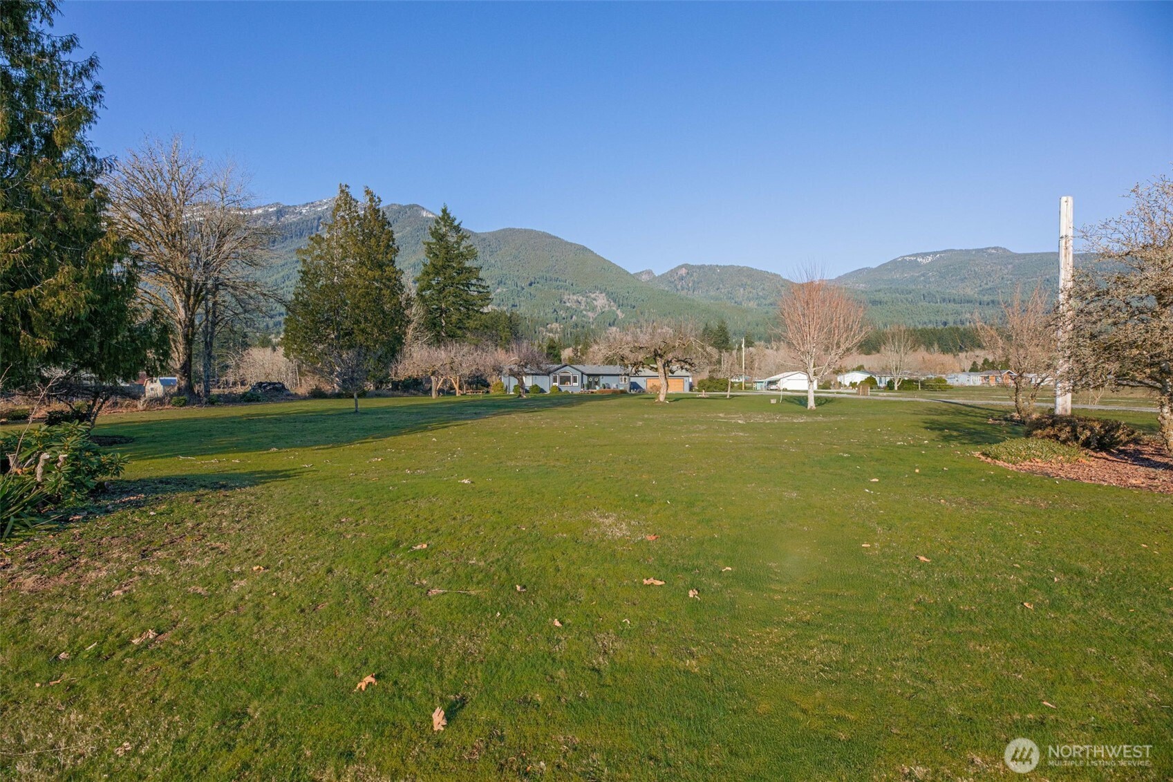 36721 Swede Heaven Road Arlington, WA 98223 - Photo 40 of 40 a view of a town with mountains in the background