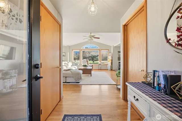 a view of living room with furniture and a large window