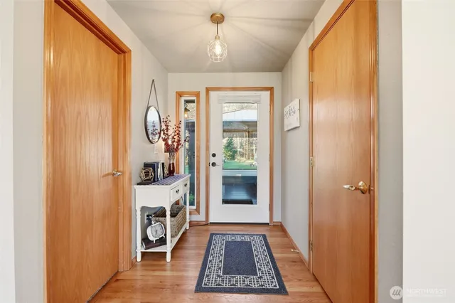a view of a hallway to rooms
