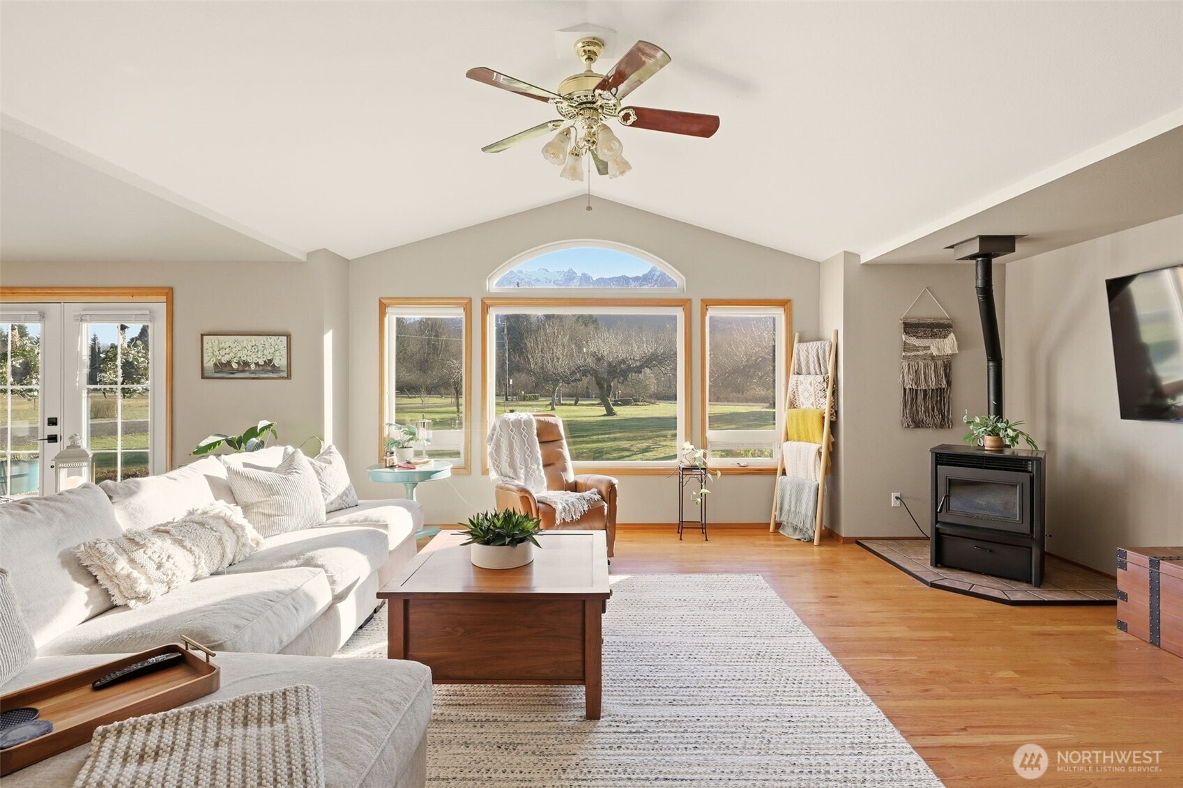 36721 Swede Heaven Road Arlington, WA 98223 - Photo 6 of 40 a living room with furniture and a floor to ceiling window