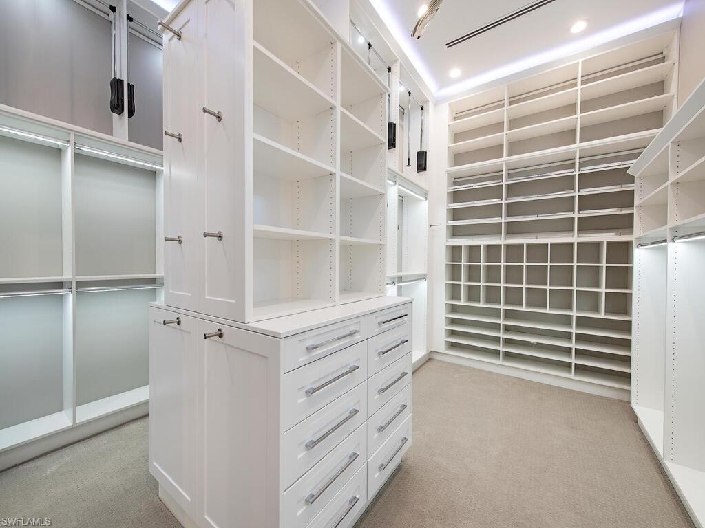 555 Mooring Line Drive Naples, FL 34103 - Photo 17 of 27 a view of walk in closet with empty racks