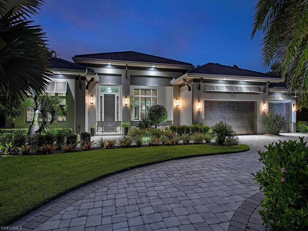 555 Mooring Line Drive Naples, FL 34103 - Photo 2 of 27 a view of a porch with a yard