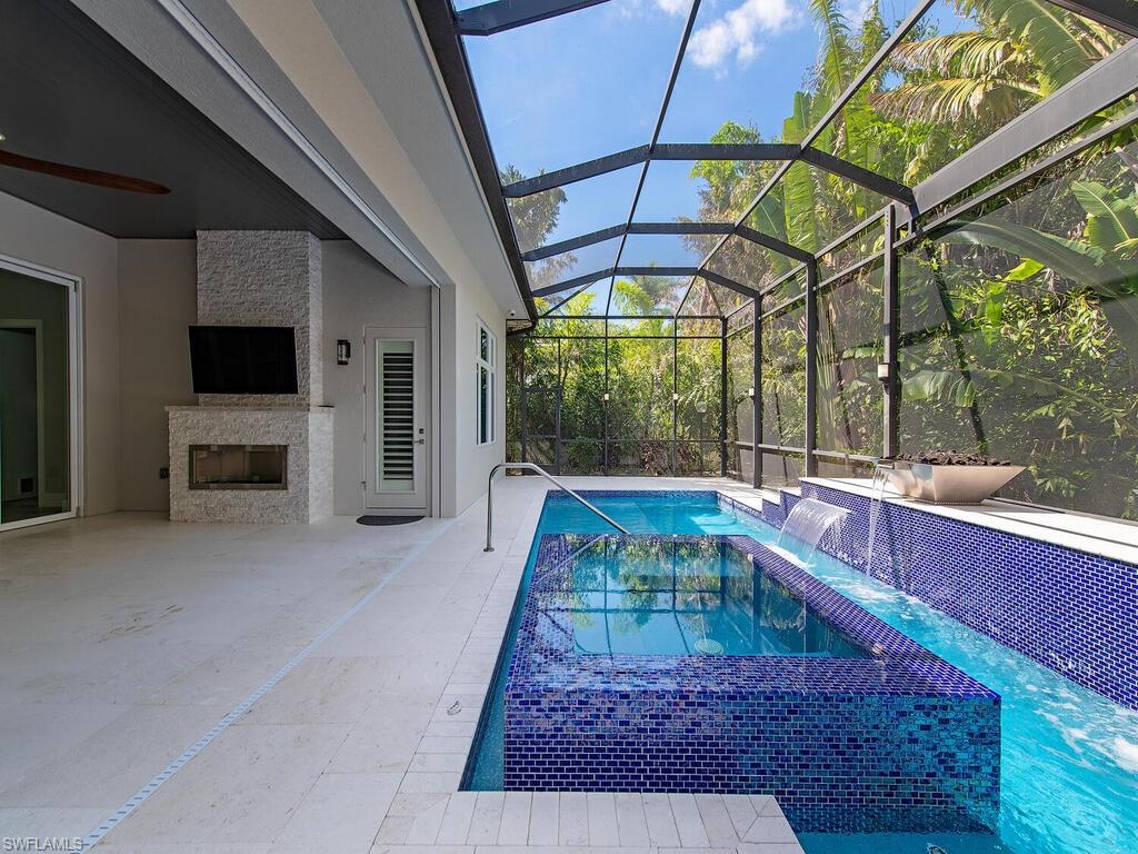 555 Mooring Line Drive Naples, FL 34103 - Photo 22 of 27 a room with pool table and windows