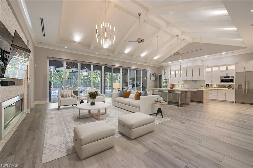 555 Mooring Line Drive Naples, FL 34103 - Photo 5 of 27 a living room with furniture kitchen view and a large window
