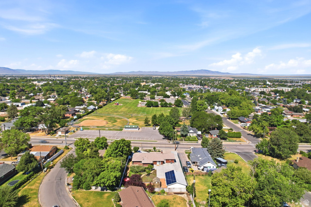 1180 North 400 East Bountiful, UT 84010 - Photo 45 of 50 Aerial perspective showcasing a residential area with mature trees and distant mountains