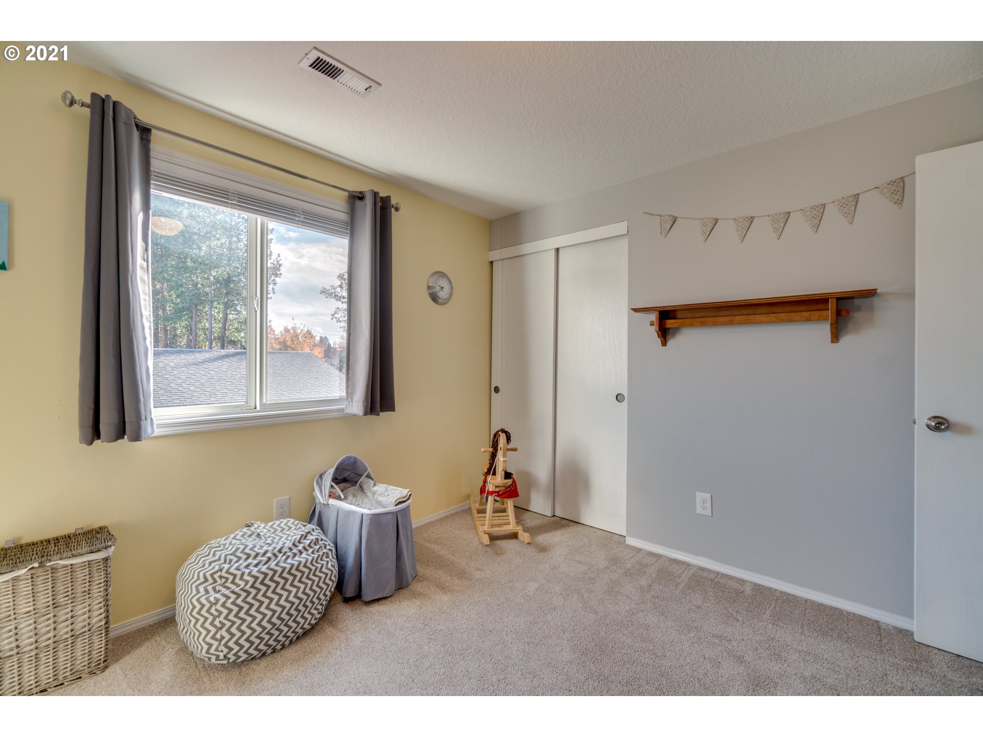 16934 Southwest Steele Way Beaverton, OR 97006 - Photo 19 of 27 a bedroom with furniture and a large window