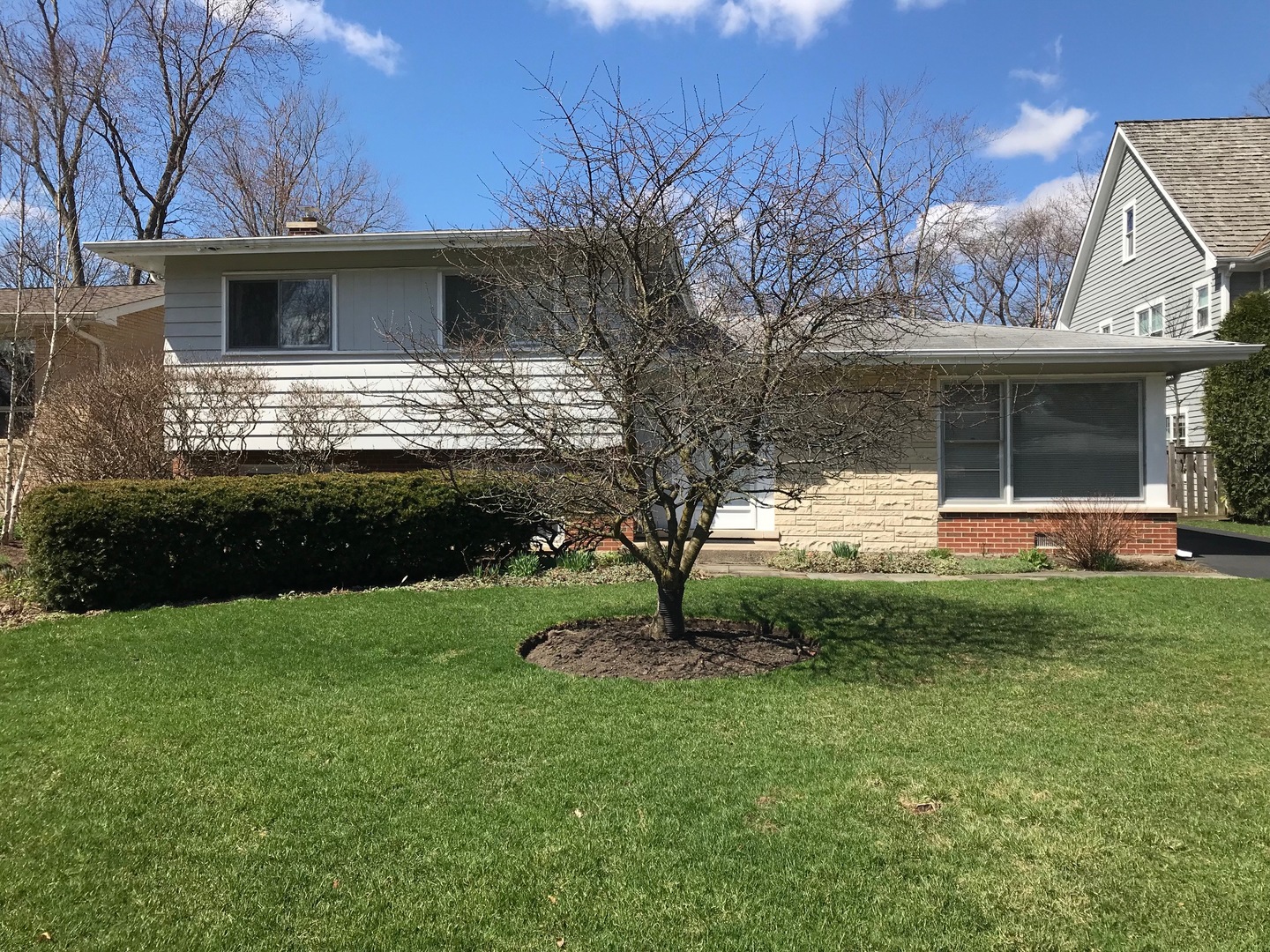 1218 Kenton Road Deerfield, IL 60015 - Photo 3 of 15 a front view of a house with garden